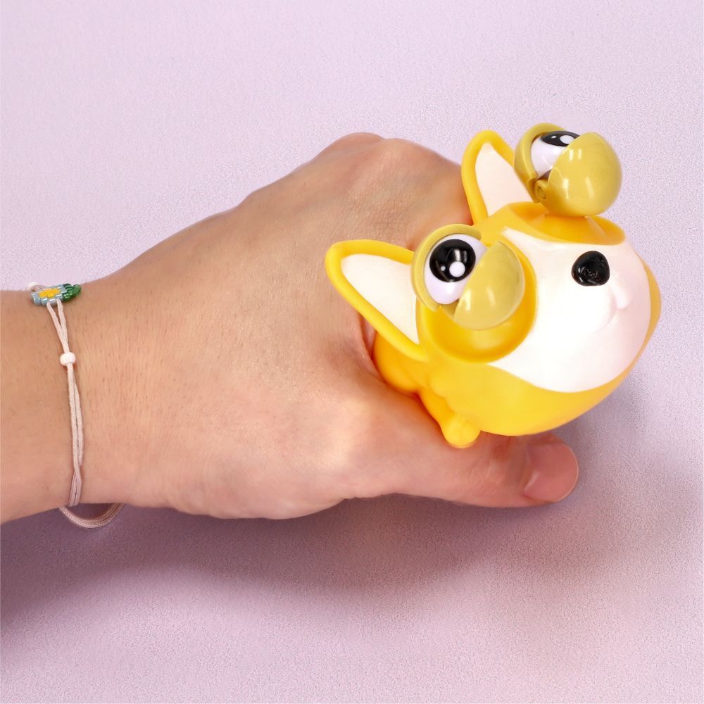 Juguete perrito con ojos saltones