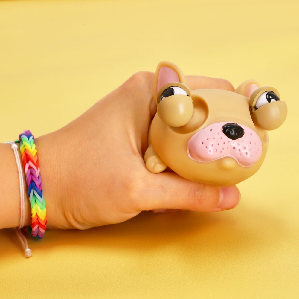 Juguete perrito con ojos saltones